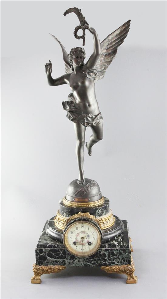 An early 20th century French bronzed spelter and green marble mantel clock, 27.5in.